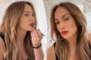 Jenifer Lopez applying red lipstick