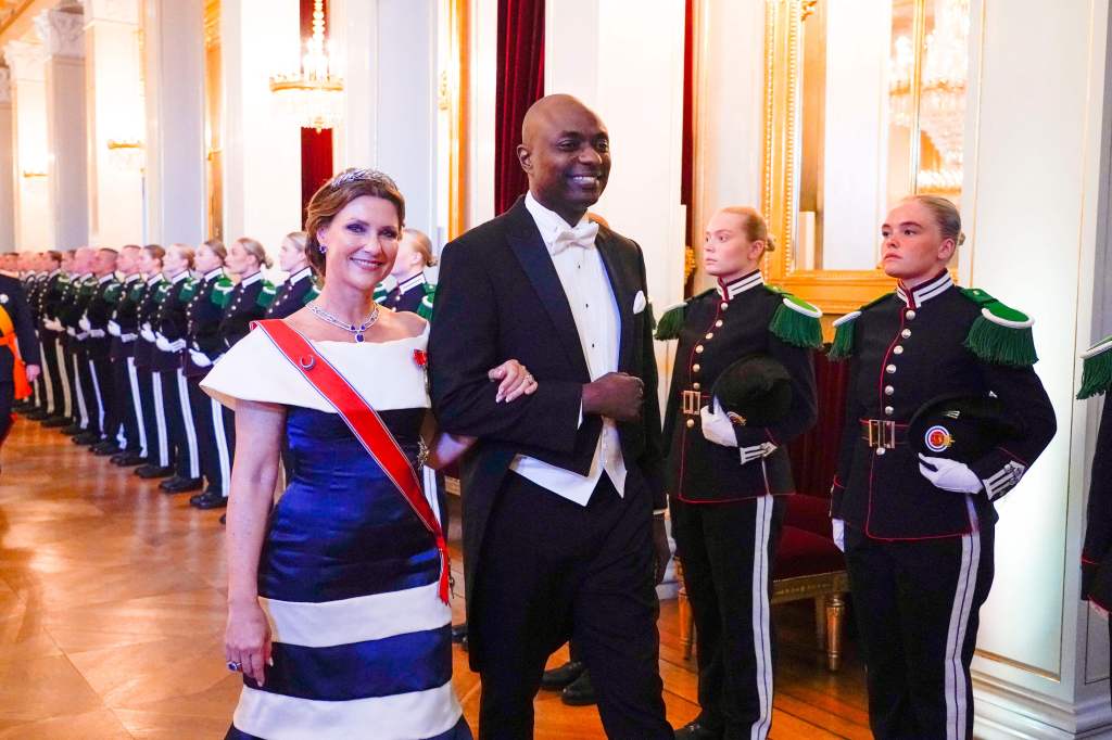 Märtha Louise and Durek Verrett in formal wear with soldiers in uniform