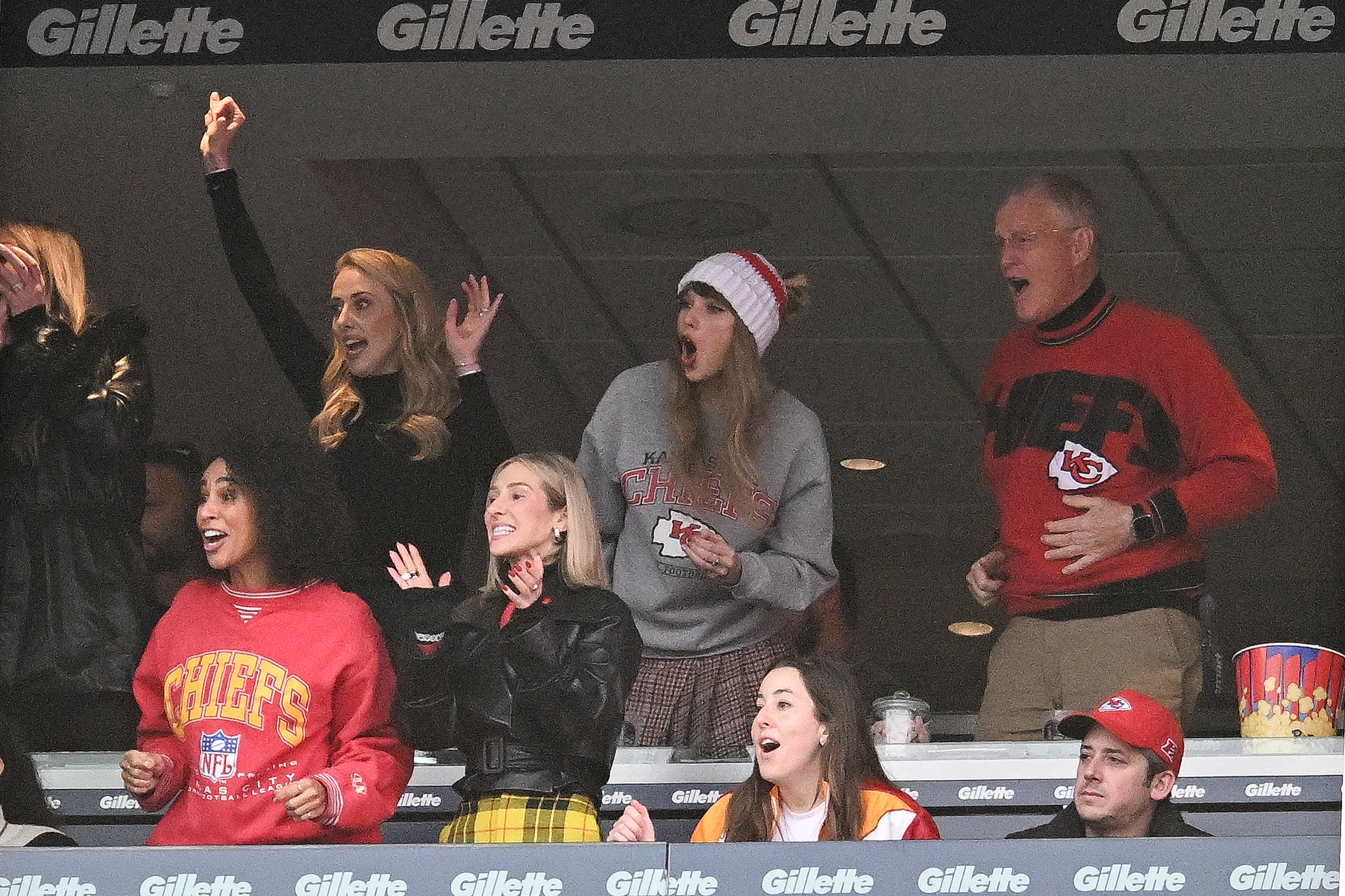 Taylor Swift and her dad with Brittany Mahomes.