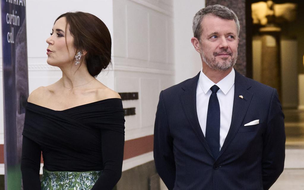 Prince Frederik of Denmark and Princess Mary staring in opposite directions