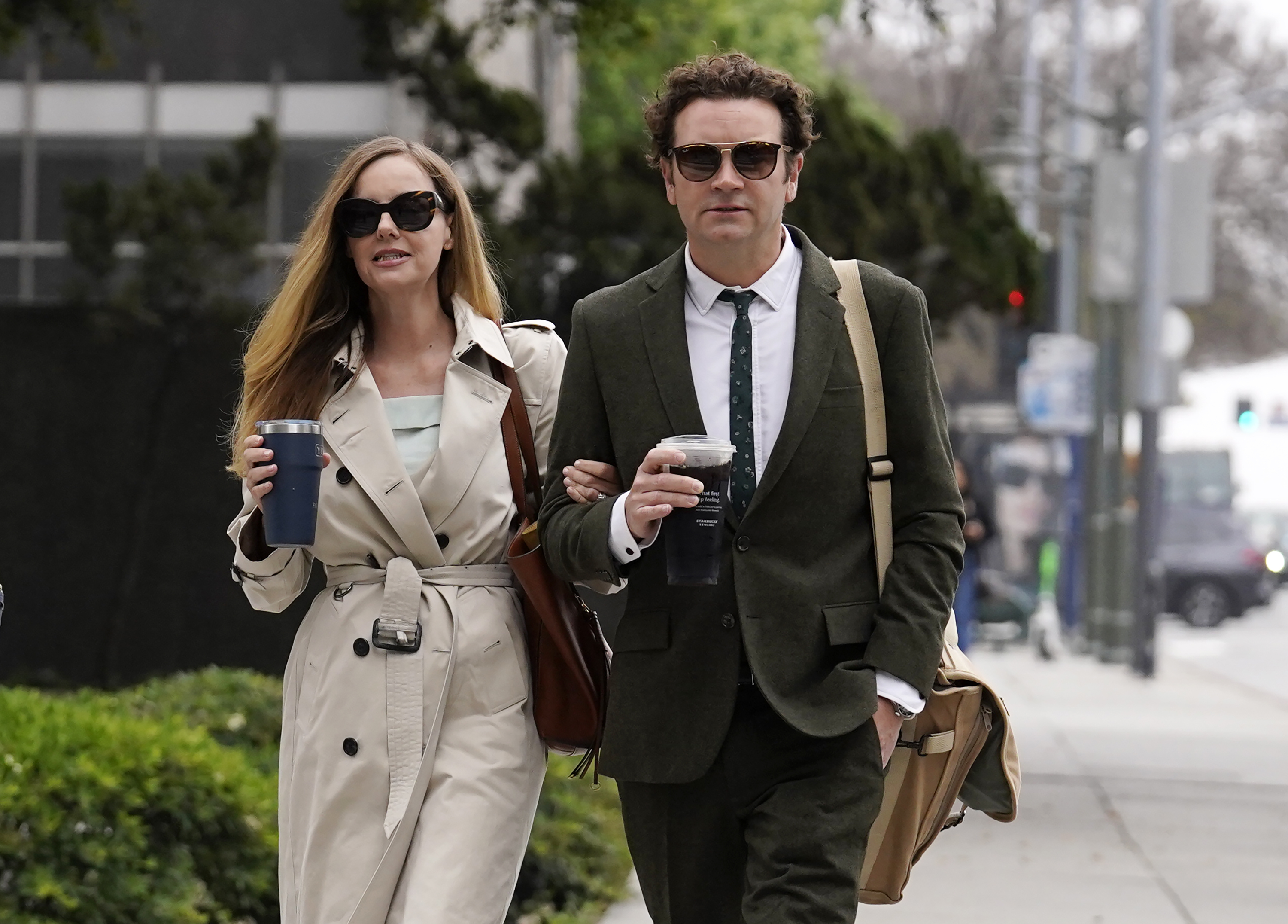 Danny Masterson and his wife Bijou Phillips walking into court