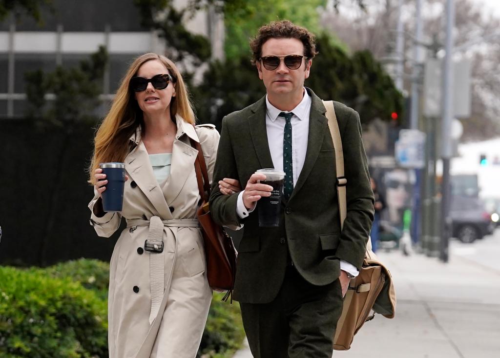 Danny Masterson and his wife Bijou Phillips walking into court