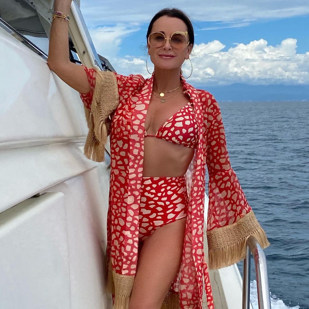 Kyle Richards dons a spotted bikini and shows off her svelte figure on a boat.