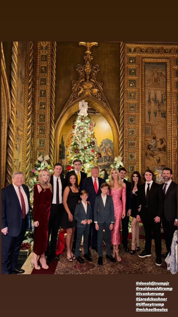 trump family in front of a christmas tree