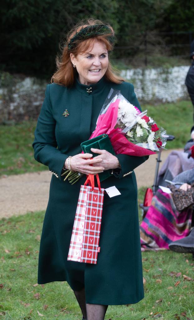 Sarah Ferguson walking with flowers in her arms